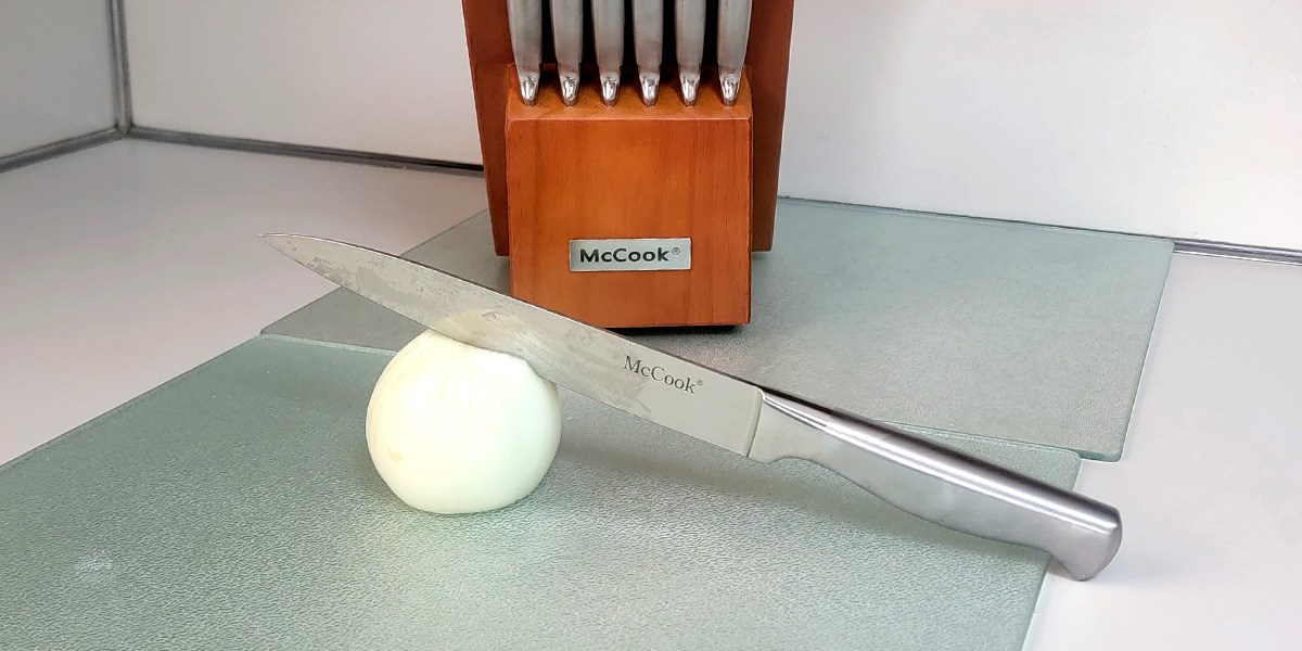 McCook Knife Set on kitchen counter with knife and onion in front McCook Knife Set on kitchen counter with knife and onion in front