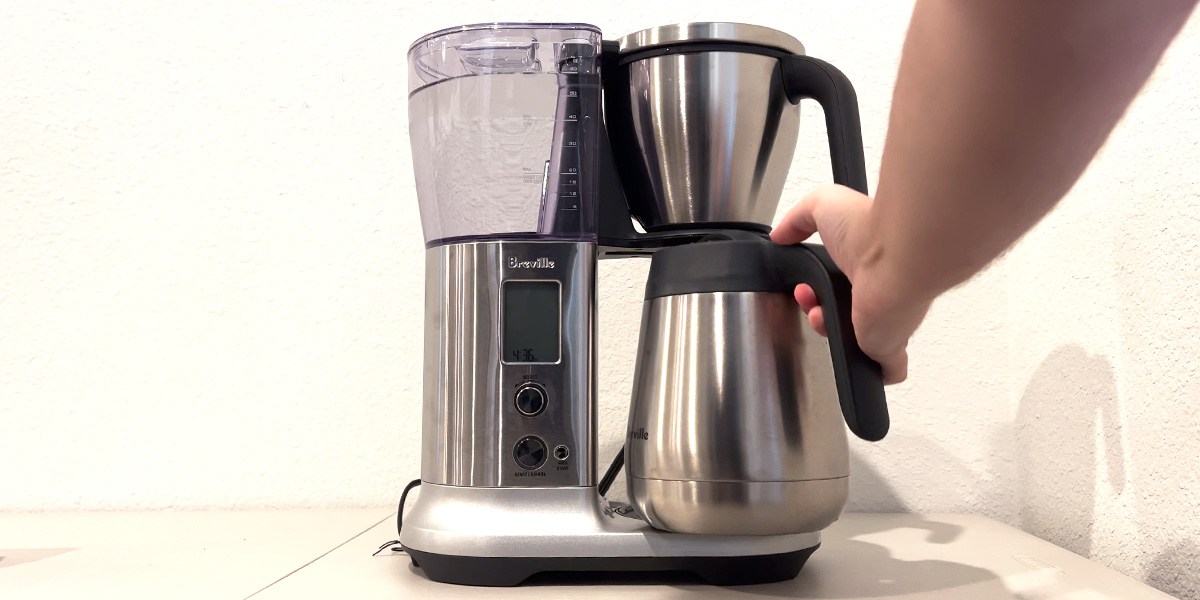 Hand on Breville Precision Brewer carafe handle  Hand on Breville Precision Brewer carafe handle