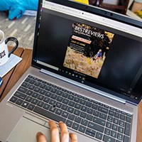 Person surfing internet on laptop computer