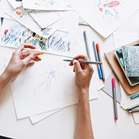 a person using paint pens