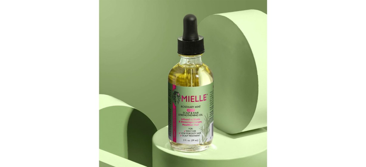 Mielle Organics Rosemary Mint Light Scalp &amp; Hair Strengthening Oil on mint green background