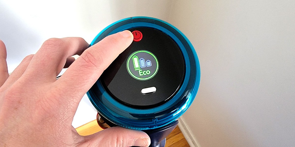 Hand touching Dyson Gen5outsize Absolute's power button 