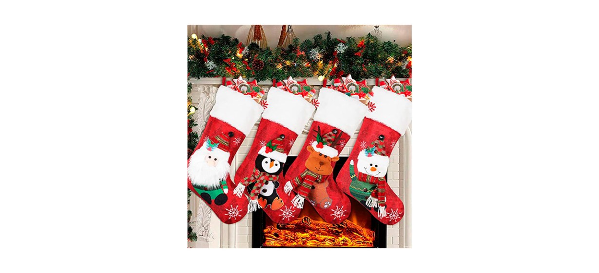 4 red Christmas stockings; images of a gnome, penguin, reindeer or snowman on them