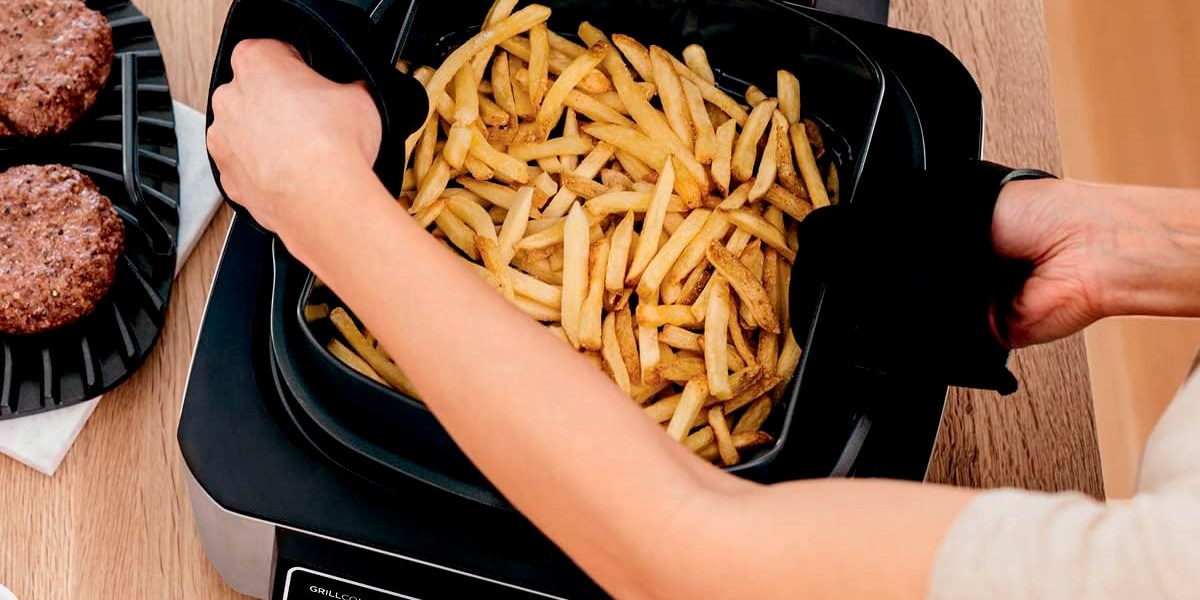 Air fryer with fries in basket